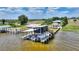 Exterior view of a boat dock with lifts and stairs on a waterfront property at 1395 S Lake Reedy Blvd, Frostproof, FL 33843