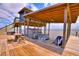 A covered boat dock with boat and jet ski lifts, seating, and water views at 1395 S Lake Reedy Blvd, Frostproof, FL 33843