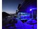Night shot of covered boat dock with lifts and built in bar and chairs at 1395 S Lake Reedy Blvd, Frostproof, FL 33843