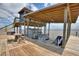 Covered boathouse with boat and jet ski lifts and a seating area offer waterfront fun at 1395 S Lake Reedy Blvd, Frostproof, FL 33843