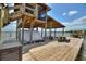 Covered boathouse with boat lift and entertaining space offers stunning waterfront views at 1395 S Lake Reedy Blvd, Frostproof, FL 33843
