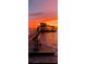 Scenic view of a private dock at sunset, perfect for relaxing or fishing at 1395 S Lake Reedy Blvd, Frostproof, FL 33843