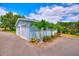 Detached garage featuring multiple bays, offering plenty of space for vehicles or storage at 1395 S Lake Reedy Blvd, Frostproof, FL 33843
