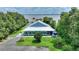 A charming home with a metal roof and screened-in porch near a picturesque lake at 1395 S Lake Reedy Blvd, Frostproof, FL 33843