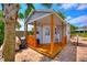 Charming cottage featuring a cozy porch, perfect for relaxing or enjoying outdoor meals at 1395 S Lake Reedy Blvd, Frostproof, FL 33843