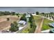 Well-maintained home with waterfront views, driveway, a spacious lot and outbuildings at 1395 S Lake Reedy Blvd, Frostproof, FL 33843