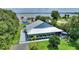 Stylish home with a metal roof, spacious deck, screened porch, and an above ground pool at 1395 S Lake Reedy Blvd, Frostproof, FL 33843
