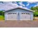 Detached garage featuring multiple bays, offering plenty of space for vehicles or storage at 1395 S Lake Reedy Blvd, Frostproof, FL 33843