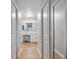 Hallway with white cabinets leading to the primary bath at 1395 S Lake Reedy Blvd, Frostproof, FL 33843
