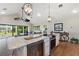 Bright, updated kitchen features a large island, modern appliances, and seamless flow to the cozy living area at 1395 S Lake Reedy Blvd, Frostproof, FL 33843