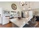 Bright kitchen with quartz counters, brick backsplash, stainless appliances and farmhouse sink at 1395 S Lake Reedy Blvd, Frostproof, FL 33843
