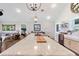 Bright, modern kitchen with stainless steel appliances, farm sink, and open shelving at 1395 S Lake Reedy Blvd, Frostproof, FL 33843