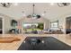 Open-concept living area with view of backyard, featuring a screened patio and stylish furnishings at 1395 S Lake Reedy Blvd, Frostproof, FL 33843