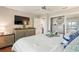 The main bedroom features wood floors and a dresser with a tv at 1395 S Lake Reedy Blvd, Frostproof, FL 33843
