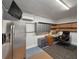 Home office with stainless refrigerator and desk, perfect for remote work at 1395 S Lake Reedy Blvd, Frostproof, FL 33843