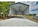 Large, open-sided outbuilding with a concrete floor, offering ample space for storage or projects at 1395 S Lake Reedy Blvd, Frostproof, FL 33843