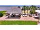 Outdoor oasis features a tiki hut, dining and seating, perfect for relaxing or entertaining at 1395 S Lake Reedy Blvd, Frostproof, FL 33843