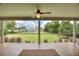 Screened porch overlooking the backyard with views of the pool and lake at 1395 S Lake Reedy Blvd, Frostproof, FL 33843