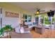 Inviting screened porch with comfortable seating and stylish decor, perfect for outdoor living and relaxation at 1395 S Lake Reedy Blvd, Frostproof, FL 33843