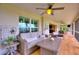 The well-furnished and decorated screened porch with comfortable seating perfect for relaxation and entertaining at 1395 S Lake Reedy Blvd, Frostproof, FL 33843