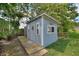 An exterior shot of the shed, showing the walkway, door, and a wreath at 1395 S Lake Reedy Blvd, Frostproof, FL 33843