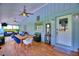 Inviting sunroom featuring a dining area, comfortable seating, and a door to the outside at 1395 S Lake Reedy Blvd, Frostproof, FL 33843