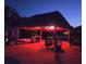 Tiki hut with bar and stool seating offers nighttime outdoor relaxation at 1395 S Lake Reedy Blvd, Frostproof, FL 33843