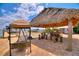 Outdoor living with tiki hut, bar, swing and water views at 1395 S Lake Reedy Blvd, Frostproof, FL 33843