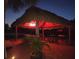 Relaxing tiki hut with cozy seating, ideal for entertaining friends and Gathering at 1395 S Lake Reedy Blvd, Frostproof, FL 33843
