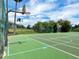 Community basketball court showing new surfacing and chain link perimeter fence at 2161 Longleaf Cir, Lakeland, FL 33810
