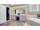 Bright Primary bathroom with separate vanities, soaking tub and view into the walk in closet at 2161 Longleaf Cir, Lakeland, FL 33810