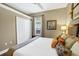 Comfortable bedroom with beige walls, a window, a ceiling fan, a closet, and soft carpet flooring for a cozy feel at 2161 Longleaf Cir, Lakeland, FL 33810