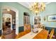 Elegant dining room features a wooden table, chandelier, and stylish decor at 2161 Longleaf Cir, Lakeland, FL 33810