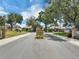 Landscaped Longleaf community entrance with brick signage surrounded by lush greenery at 2161 Longleaf Cir, Lakeland, FL 33810