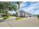Lovely single-story home with mature landscaping, a three-car garage, and extended driveway offering ample parking at 2161 Longleaf Cir, Lakeland, FL 33810