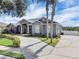 Stunning home with a well-manicured lawn, mature trees, and an elegant driveway, showing great curb appeal at 2161 Longleaf Cir, Lakeland, FL 33810