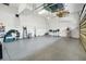 Organized two car garage with storage shelving along the walls and hanging from the ceiling at 2161 Longleaf Cir, Lakeland, FL 33810