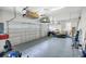 Spacious two car garage with storage shelving and plentiful room for vehicles at 2161 Longleaf Cir, Lakeland, FL 33810