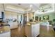 Spacious kitchen with stainless steel appliances, granite countertops, and a breakfast bar at 2161 Longleaf Cir, Lakeland, FL 33810