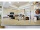 Bright kitchen featuring granite countertops, stainless steel appliances, and ample cabinet space at 2161 Longleaf Cir, Lakeland, FL 33810