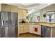 Well-equipped kitchen with stainless steel fridge, granite countertops, and ample counter space at 2161 Longleaf Cir, Lakeland, FL 33810