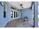 Covered patio with ceiling fans, patterned concrete flooring, and access to the backyard at 2161 Longleaf Cir, Lakeland, FL 33810