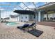 Inviting pool area featuring lounge chairs and an umbrella, ideal for outdoor relaxation and entertainment at 2161 Longleaf Cir, Lakeland, FL 33810