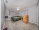 Bright bedroom with a ceiling fan, gray walls and modern flooring at 129 5Th Jpv St, Winter Haven, FL 33880