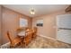 Dining Room featuring wood table with six chairs and view of small window at 129 5Th Jpv St, Winter Haven, FL 33880