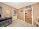 Entrance hallway featuring tile flooring, and views into other rooms of the home at 129 5Th Jpv St, Winter Haven, FL 33880