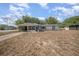 View of home, featuring covered carport and screen porch in need of renovation at 129 5Th Jpv St, Winter Haven, FL 33880