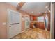Cozy kitchen featuring tile flooring, wooden cabinets, stainless steel refrigerator, and a door to the outside at 129 5Th Jpv St, Winter Haven, FL 33880