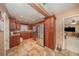 Well-lit kitchen with stainless steel appliances, wood cabinets, and tile flooring at 129 5Th Jpv St, Winter Haven, FL 33880