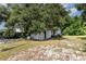 Exterior of the backyard shed surrounded by trees at 129 5Th Jpv St, Winter Haven, FL 33880
